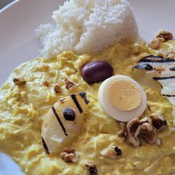 Chicken stew with potatoes, sliced egg and walnuts, side of jasmine rice