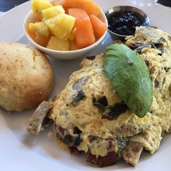 Beach Plum Kitchen - 3 egg omelette w/ Applewood smoked bacon, chicken & apple sausage, roasted poblano peppers, avocado & goat cheese. House made biscuit. - New American Near Me - Carlsbad, California