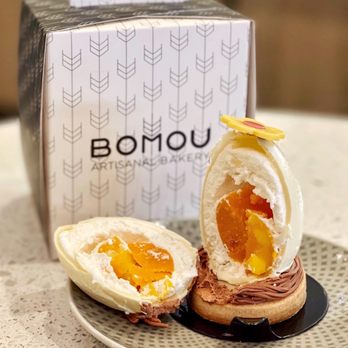 Bomou Artisanal Bakery - a half eaten sandwich on a plate - Bakeries Near Me - Toronto, Ontario Bomou Artisanal Bakery - a half eaten sandwich on a plate - Bakeries Near Me - Toronto, Ontario