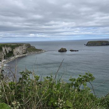 Carrick-a-rede Rope Bridge - Gorgeous coastlines walking towards the rope bridge ... - Local Flavor Near Me - Ballintoy, ANT