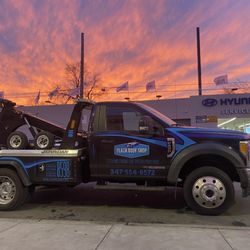 Plaza Body Shop - Plaza Towing: Your Vehicle's Rescue at Any Hour!