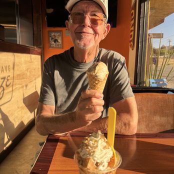 Mojave Freeze - Scoop of ice cream in a cone and caramel crunch sundae. - Ice Cream & Frozen Yogurt Near Me - Yucca Valley, California Mojave Freeze - Scoop of ice cream in a cone and caramel crunch sundae. - Ice Cream & Frozen Yogurt Near Me - Yucca Valley, California