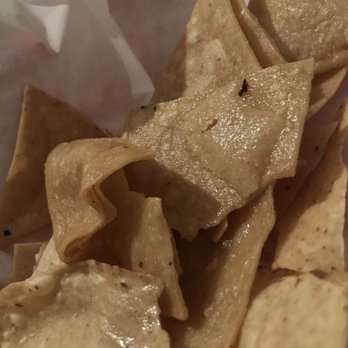 La Santisima - Basket of tortilla chips, as served to us. DROWNING in oil and so unappetizing. Tasted old and gross too. - Mexican Near Me - Phoenix, Arizona