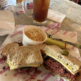 Pastrami and Swiss on rye with a side of potato salad. Pastrami and Swiss on rye with a side of potato salad.