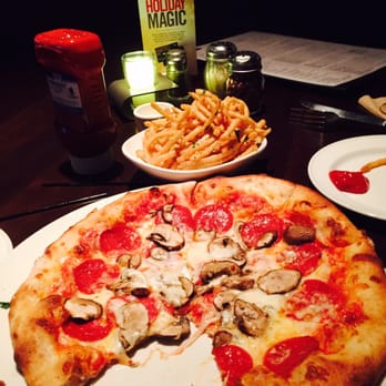 Yard House - Truffle Cheese French Fries and Pepperoni and Mushroom Pizza. - New American Near Me - Rancho Mirage, California Yard House - Truffle Cheese French Fries and Pepperoni and Mushroom Pizza. - New American Near Me - Rancho Mirage, California