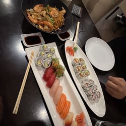 Chef deluxe with California roll, spicy salmon roll, Kani roll, and chicken shrimp yakisoba noodles