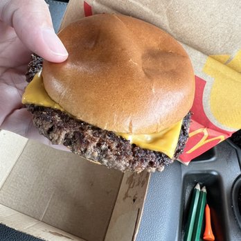 McDonald's - Quarter Pounder with Cheese top with baby cheeseburger bun. - Burgers Near Me - Selma, California McDonald's - Quarter Pounder with Cheese top with baby cheeseburger bun. - Burgers Near Me - Selma, California