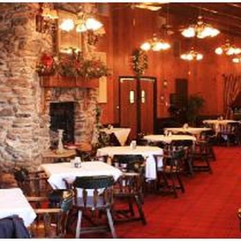 The Hearth - a dining room with tables and chairs - Pubs Near Me - Gladwin, Michigan The Hearth - a dining room with tables and chairs - Pubs Near Me - Gladwin, Michigan