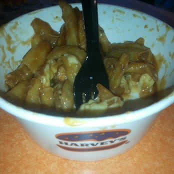 Harvey's - a bowl of food with a fork in it - Burgers Near Me - London, Ontario