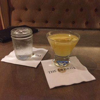 The Driskill Bar - Texas Orange Blossom and a glass of water in mini mason jars! - Lounges Near Me - Austin, Texas The Driskill Bar - Texas Orange Blossom and a glass of water in mini mason jars! - Lounges Near Me - Austin, Texas
