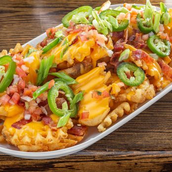 NOX Eatery & Public House - Loaded waffle fries - Sports Bars Near Me - Ottawa, Ontario NOX Eatery & Public House - Loaded waffle fries - Sports Bars Near Me - Ottawa, Ontario