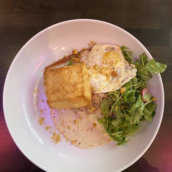 Table 33 - Biscuits and gravy - with corn cream, apple butter, fried egg, sausage gravy, and arugula. - Breakfast & Brunch Near Me - Dayton, Ohio Table 33 - Biscuits and gravy - with corn cream, apple butter, fried egg, sausage gravy, and arugula. - Breakfast & Brunch Near Me - Dayton, Ohio