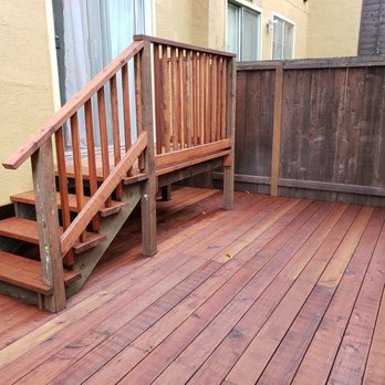 RCO General Construction - a wooden deck with stairs - Decks & Railing Near Me
