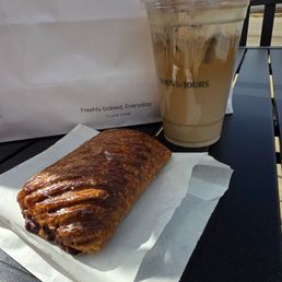 Crisp pastry with delicious chocolate filling.  Iced coffee.