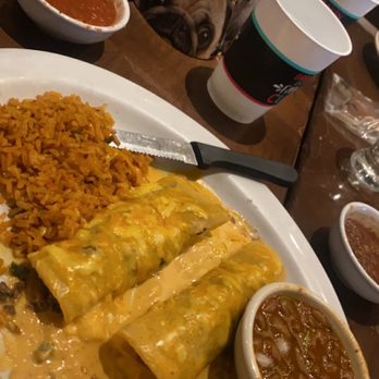 Uncle Julio's - 2 beef enchiladas with agave queso, beans and rice. - Tex-Mex Near Me - Oklahoma City, Oklahoma Uncle Julio's - 2 beef enchiladas with agave queso, beans and rice. - Tex-Mex Near Me - Oklahoma City, Oklahoma