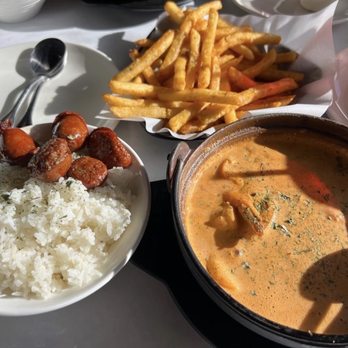Craving Crab Haus - Deluxe Pan Roast & Cajun Fries this is what my husband had. - Cajun/Creole Near Me - Riverside, California