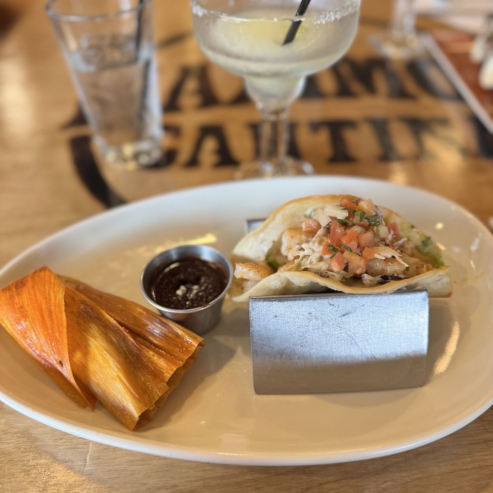 Maximo's Cantina - Pork tamal and shrimp taco with a fried flour shell - Mexican Near Me - Elkhorn, Nebraska Maximo's Cantina - Pork tamal and shrimp taco with a fried flour shell - Mexican Near Me - Elkhorn, Nebraska