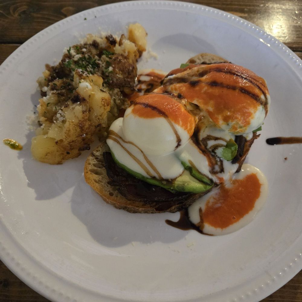 Author's Kitchen + Bar - Special of the day, Avocado toast with poached egg, mornay, tomato sauce, balsamic and a side of breakfast potatoes. - Bars Near Me - Appleton, Wisconsin