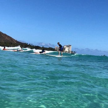 Mickeys Surf School - My son getting up after a few quick lessons from Mickey! - Paddleboarding Near Me - Honolulu, Hawaii Mickeys Surf School - My son getting up after a few quick lessons from Mickey! - Paddleboarding Near Me - Honolulu, Hawaii