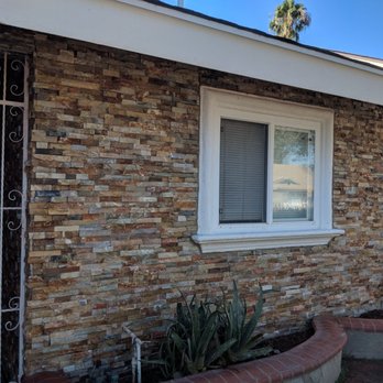 Equity Pavers - a brick house with a gate and window - Masonry/Concrete Near Me Equity Pavers - a brick house with a gate and window - Masonry/Concrete Near Me