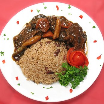Jerk Pit - a white plate with rice and vegetables - Caribbean Near Me - Tampa, Florida