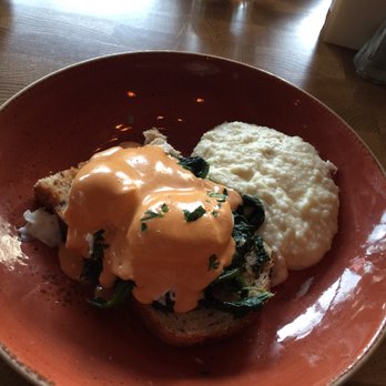 The Promontory - Delicious grits with hearty multi-grain bread, spinach, poached eggs, and hollandaise sauce. Eggs slightly over cooked. - Bars Near Me - Chicago, Illinois The Promontory - Delicious grits with hearty multi-grain bread, spinach, poached eggs, and hollandaise sauce. Eggs slightly over cooked. - Bars Near Me - Chicago, Illinois