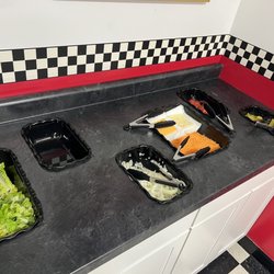 Blue Grass Drive-In - Walking taco bar and hamburger hot dog condiment section