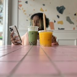 Teaspoons & Co. - 20 oz Strawberry matcha latte and 17 oz mango slush.