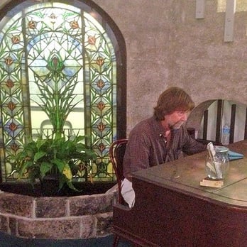 Cafe Alcazar - Cafe Alcazar's promo photo of the pianist (not my photo).  Coincidentally, the same pianist was playing on our lunch visit! - New American Near Me - Saint Augustine, Florida