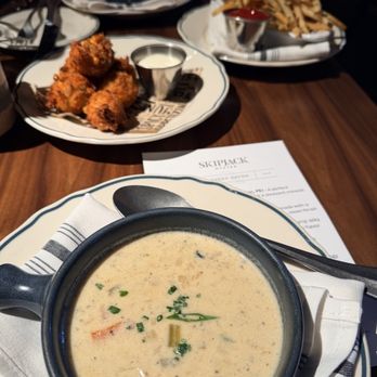 Skipjack Oyster - Cup of chowder,crab hush puppies and fries - Seafood Near Me - Austin, Texas Skipjack Oyster - Cup of chowder,crab hush puppies and fries - Seafood Near Me - Austin, Texas