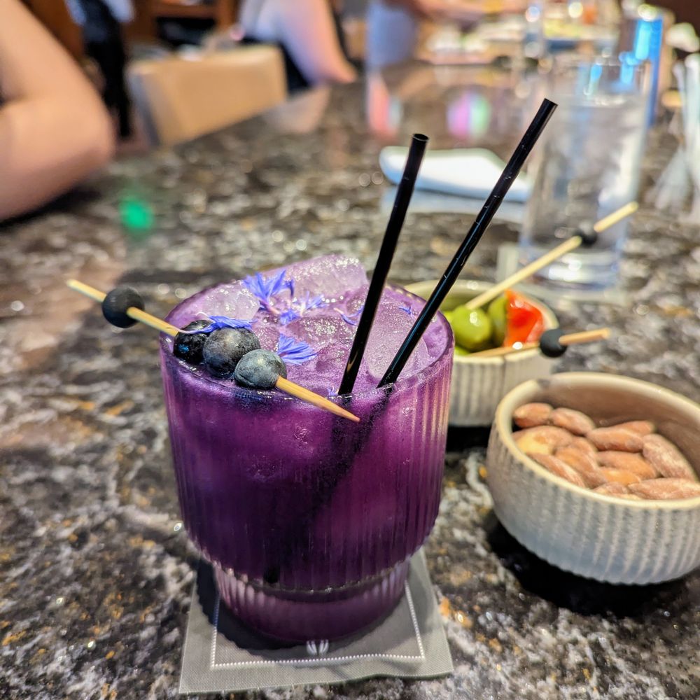 The Umstead Hotel - Lilac cocktail at the hotel bar. $16. Cathead vodka, creme de violette, blueberry, lychee, yuzu. - Hotels Near Me - Cary, North Carolina