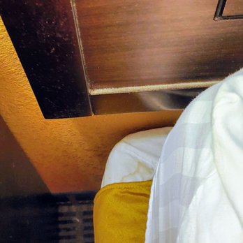 Ramada By Wyndham - Flagstaff East - I was showing the dust on headboard. It wasn't until I saw the picture that saw the stain. - Hotels Near Me - Flagstaff, Arizona