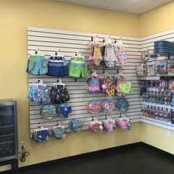 AquaKids - Our Swim Shop carries everything that your child needs! We have goggles, swim diapers, swim suits, ear plugs, kickboards, and more!
