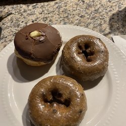 Blueberry cake donuts and a chocolate glazed with Bavarian creme
