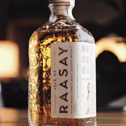 Royal Mile Whiskies - Raasay peated whisky is matured in Rye whiskey, fresh Chinkapin oak and Bordeaux red wine, using water from the Well of the Pale Cow.