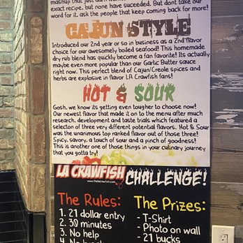 LA Crawfish - a menu on a brick wall - Vietnamese Near Me - Houston, Texas