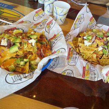 Beach Hut Deli - Marley nachos one with bacon the other with out - New American Near Me - Huntington Beach, California Beach Hut Deli - Marley nachos one with bacon the other with out - New American Near Me - Huntington Beach, California