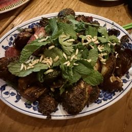 Delicious fried brussels sprouts with pork belly