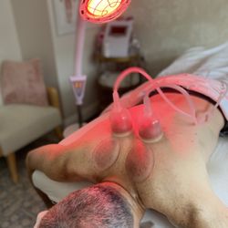 Body Sculpting by Lisa - Cupping Therapy with inferred light to help relieve pain.