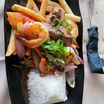 Jalea Peruvian Cuisine - Steak and shrimp along with white rice. - Peruvian Near Me - Hicksville, New York Jalea Peruvian Cuisine - Steak and shrimp along with white rice. - Peruvian Near Me - Hicksville, New York