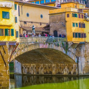 Ponte Vecchio - Ponte Vecchio in the heart of Tuscany. Many historic bridges and buildings from Medieval times and the Italian Renaissance - Local Flavor Near Me - Florence, FI