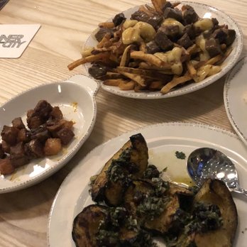 Free House - plates of food on a table - Wine Bars Near Me - Calgary, Alberta Free House - plates of food on a table - Wine Bars Near Me - Calgary, Alberta