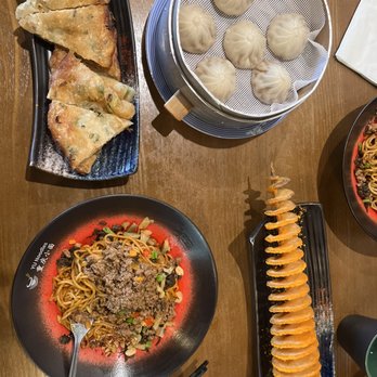 Yu Noodles - S1. Scallion Pancake , Potato Tower , Pork Soup Dumplings (6pcs) , N5. Yibin Spicy Dry Noodle - Chinese Near Me - Fairfax, Virginia Yu Noodles - S1. Scallion Pancake , Potato Tower , Pork Soup Dumplings (6pcs) , N5. Yibin Spicy Dry Noodle - Chinese Near Me - Fairfax, Virginia