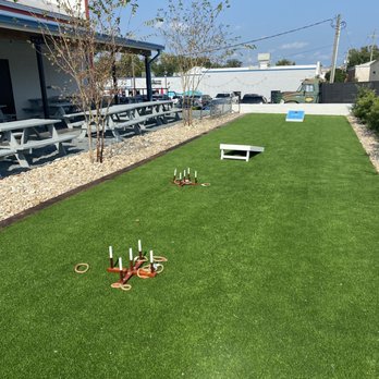 Bowstring Burgers and Brewyard - a lawn with lawn chairs and tables - Breweries Near Me - Wilmington, North Carolina Bowstring Burgers and Brewyard - a lawn with lawn chairs and tables - Breweries Near Me - Wilmington, North Carolina
