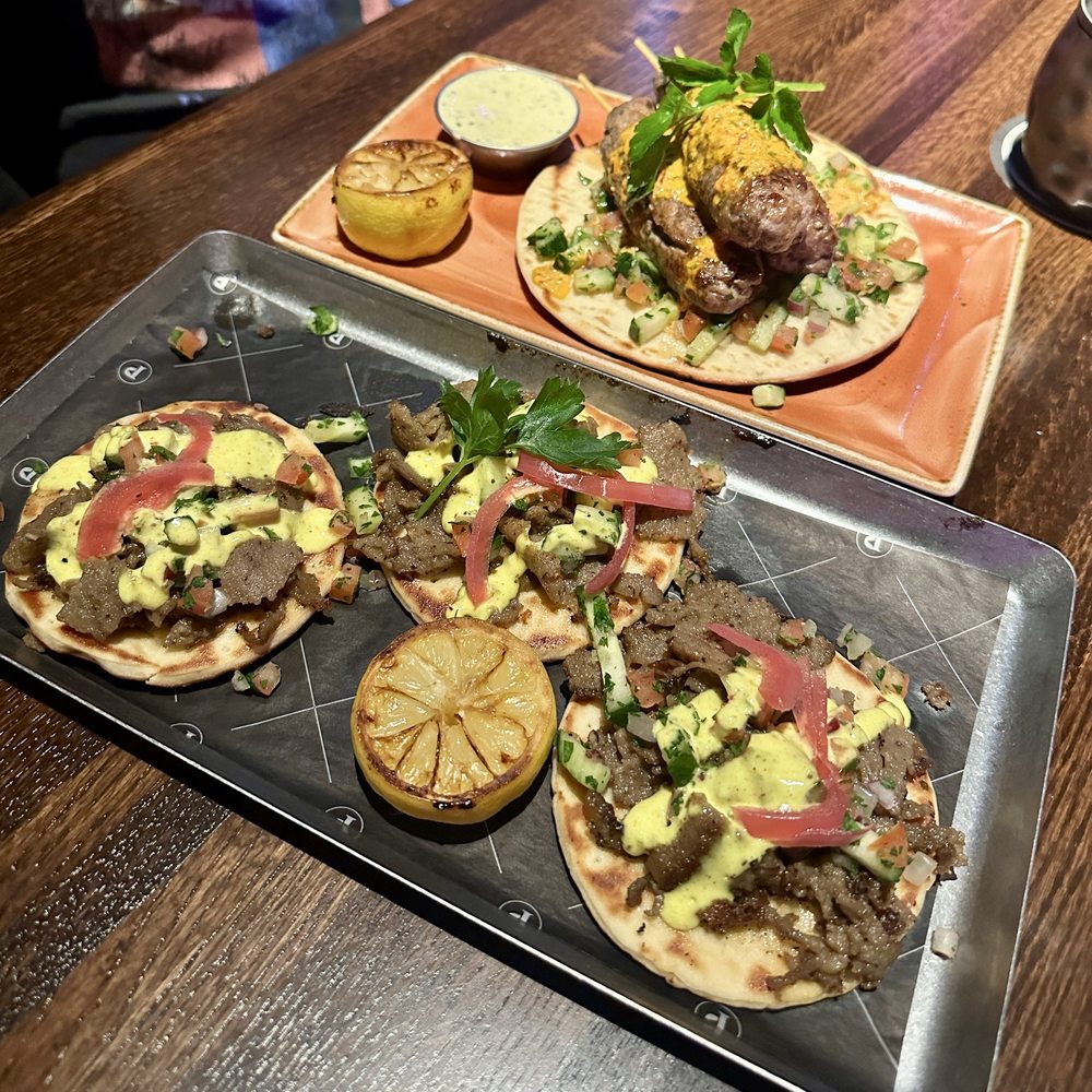 Puttshack - Dania Beach - Mediterranean lamb skewers and Greek gyro sliders - Mini Golf Near Me - Dania Beach, Florida