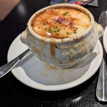 Entourage - French onion soup - absolutely delicious and messy; I dare you to eat it while on a first date! - American Near Me - Naperville, Illinois Entourage - French onion soup - absolutely delicious and messy; I dare you to eat it while on a first date! - American Near Me - Naperville, Illinois