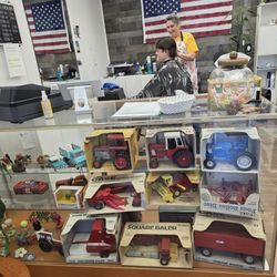 The New Barber Shop - Barbara's display case of farm implements and other items.