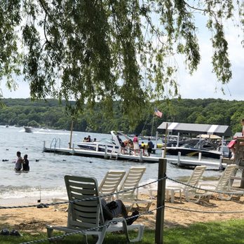 Conference Point Center - small beach with 15 people boat at the dock - Venues & Event Spaces Near Me - Williams Bay, Wisconsin