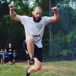 N 2 Action - Nick leaping over an obstacle in a race