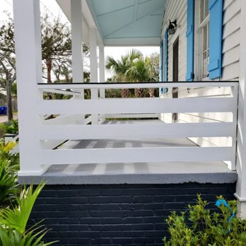 Goodrich Construction Services - a porch with blue shutters - General Contractors Near Me Goodrich Construction Services - a porch with blue shutters - General Contractors Near Me